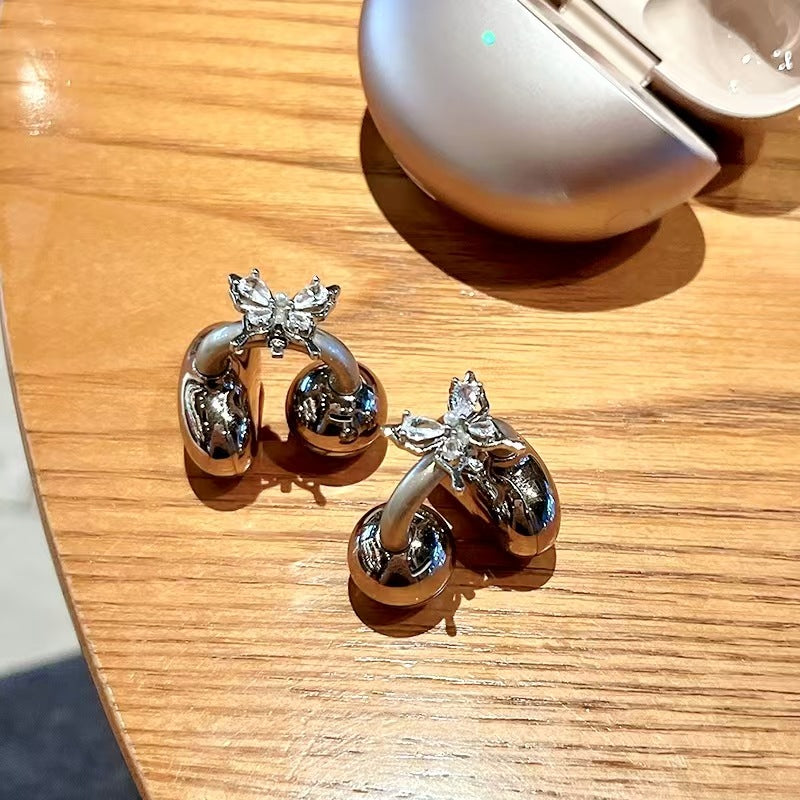 ButterFlySound™ – Les Boucles d’Oreilles Audio Élégantes et Connectées